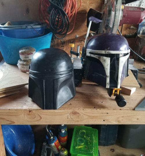 My raw helmet next to Headshot Props Custom Mando